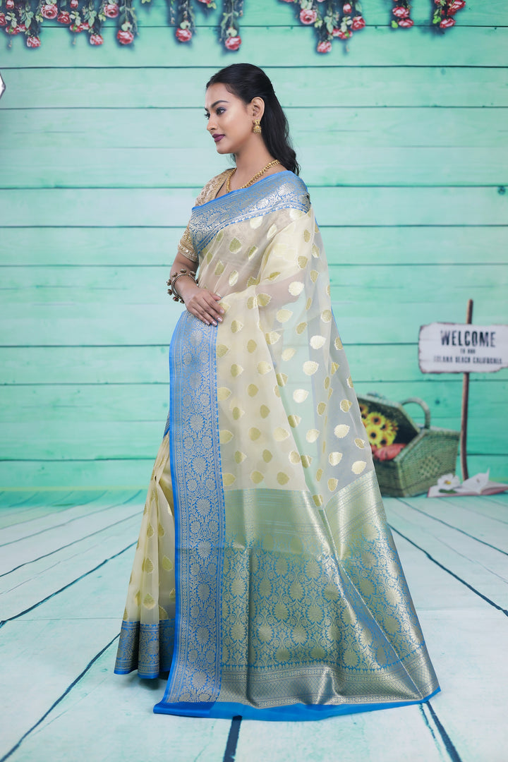 Off-white with Blue Border Tissue Saree                                                                                                                  Off-white with Blue Border Tissue Saree - Keya Seth Exclusive