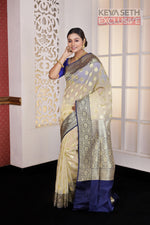 Load image into Gallery viewer, Off-white Soft Tissue Saree with Navy Blue Satin border - Keya Seth Exclusive