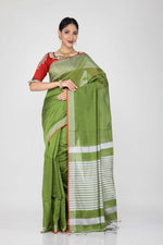 Load image into Gallery viewer, The lady is wearing a green handloom saree